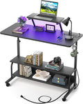 Height Adjustable Standing Desk with Power Outlets and LED Lights - 39 Manual Stand Up Desk with Monitor Stand and Storage Shelves Small Mobile Rolling Computer Desk Portable Laptop Table Black