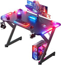 HLDIRECT 40 INCH Gaming Desk with LED Lights Home Office Gamer Desk Ergonomic Computer Table with Large Carbon Fiber Desktop Office Workstation Cup Holder &amp Headphone Hook Black