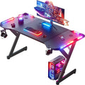 HLDIRECT 47 Inch Gaming Desk with LED Lights Ergonomic Computer Gaming Table with Carbon Fibre Surface Sturdy PC Workstation Desk for Home Office with Headphone Hook Cup Holder Black