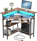 Auromie Corner Desk with Charging Station &amp LED Light Triangle Corner Desk with Monitor Stand &amp Keyboard Tray for Small Space Gaming Computer Desk with Storage Shelves for Home Office (Rusti