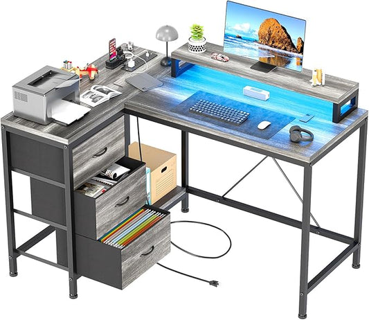 Hetoy L-Shaped Computer Desk with Charging Station – Corner Gaming Desk with LED Lights Drawers &amp Storage Shelves for Home Office Use Oak