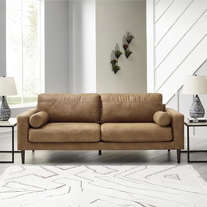 Signature Design by Ashley Telora Faux Leather Sofa 2 Bolster Pillows Loose Cushions Faux Wood Finish Accent Legs 85 W x 35 D x 35 H Dark Brown