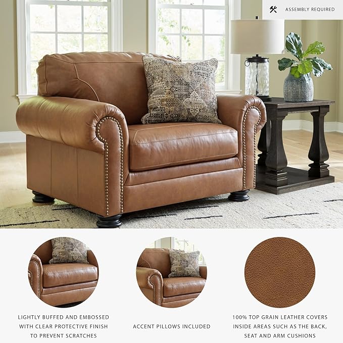 Signature Design by Ashley Carianna Contemporary Leather Match Upholstered Oversized Chair with Nailhead Trim and 1 Accent Pillow Dark Brown