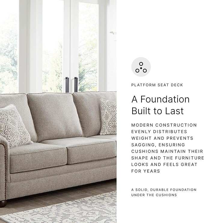 Signature Design by Ashley Gaelon Transitional Sofa with Nailheads and 2 Accent Pillows Beige