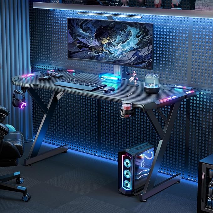 HLDIRECT 55 Inch Gaming Desk with LED Lights Ergonomic Computer Gaming Table with Carbon Fibre Surface Sturdy PC Workstation Desk for Home Office with Headphone Hook Cup Holder Black