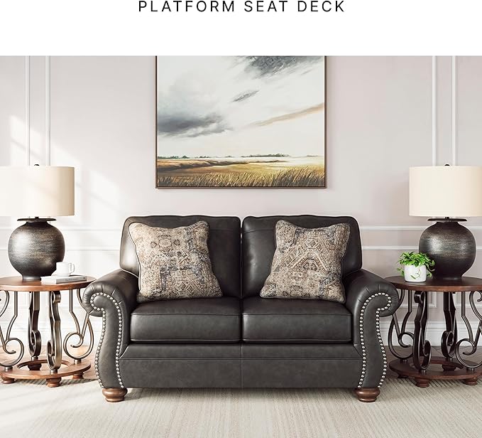 Signature Design by Ashley Chatterton Rustic Faux Leather Loveseat with Nailhead Trim and 2 Throw Pillows Reinforced Frame for Added Stability Reversible Seat Cushions Turned Legs Dark Gray