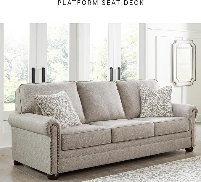 Signature Design by Ashley Gaelon Transitional Sofa with Nailheads and 2 Accent Pillows Beige