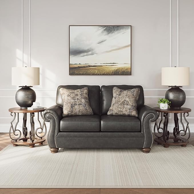 Signature Design by Ashley Chatterton Rustic Faux Leather Loveseat with Nailhead Trim and 2 Throw Pillows Reinforced Frame for Added Stability Reversible Seat Cushions Turned Legs Dark Gray