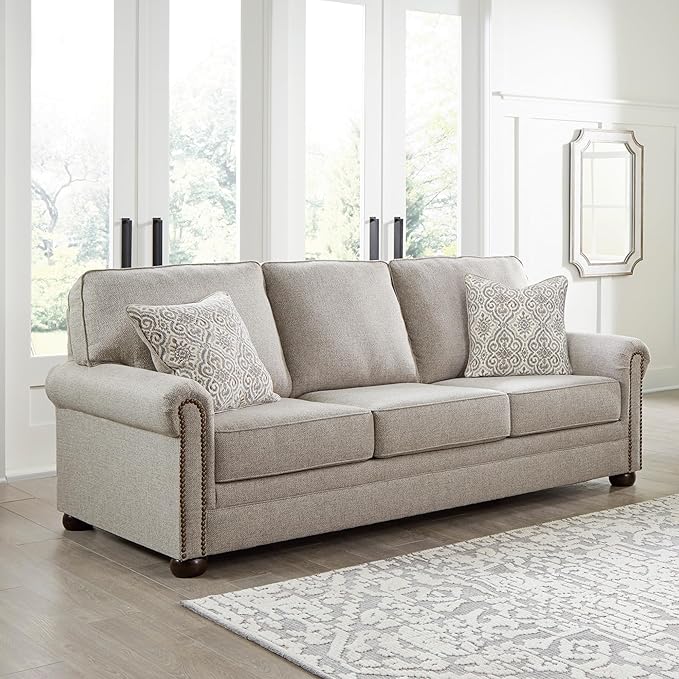 Signature Design by Ashley Gaelon Transitional Sofa with Nailheads and 2 Accent Pillows Beige