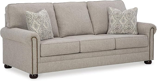 Signature Design by Ashley Gaelon Transitional Sofa with Nailheads and 2 Accent Pillows Beige