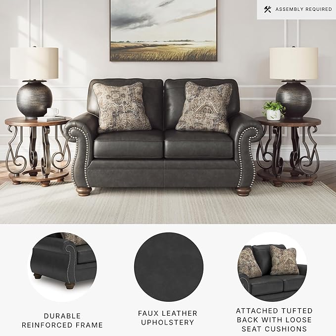 Signature Design by Ashley Chatterton Rustic Faux Leather Loveseat with Nailhead Trim and 2 Throw Pillows Reinforced Frame for Added Stability Reversible Seat Cushions Turned Legs Dark Gray