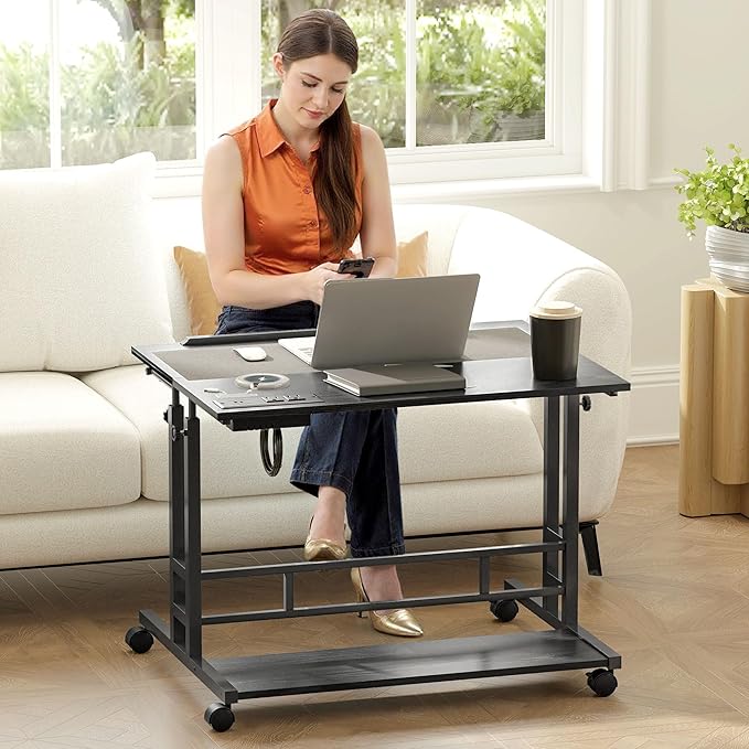 HOMCOM Height Adjustable Standing Desk with Power Outlets Stand Up Desk with Tiltable Tabletop Lockable Wheels Bottom Shelf Rolling Workstation for Home Office Black